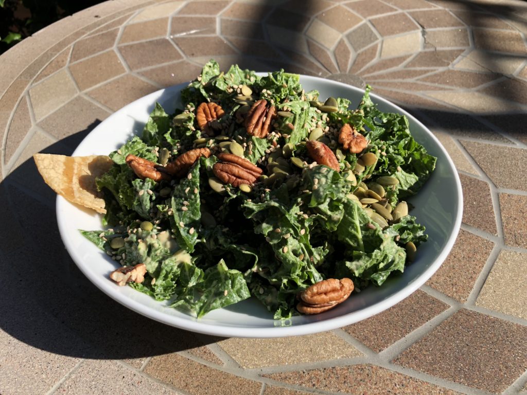 No oil kale salad with a dressing of hummus tahini & acv